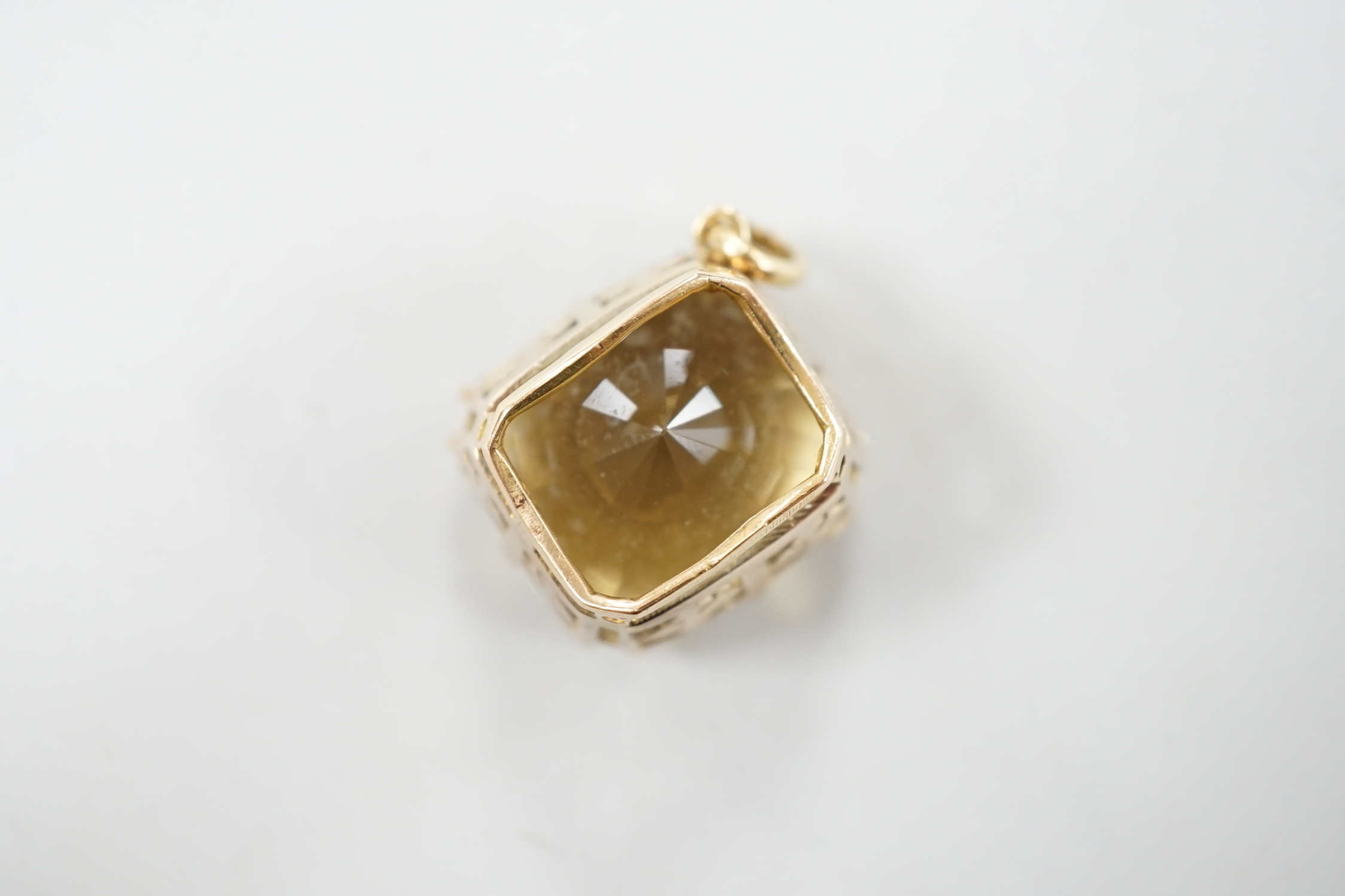 A modern 750 metal mounted citrine set pendant, 25mm, gross weight 14.8 grams.